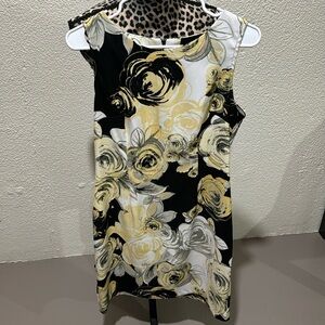 Connected yellow & black floral sleeveless dress. Brand new without tags.